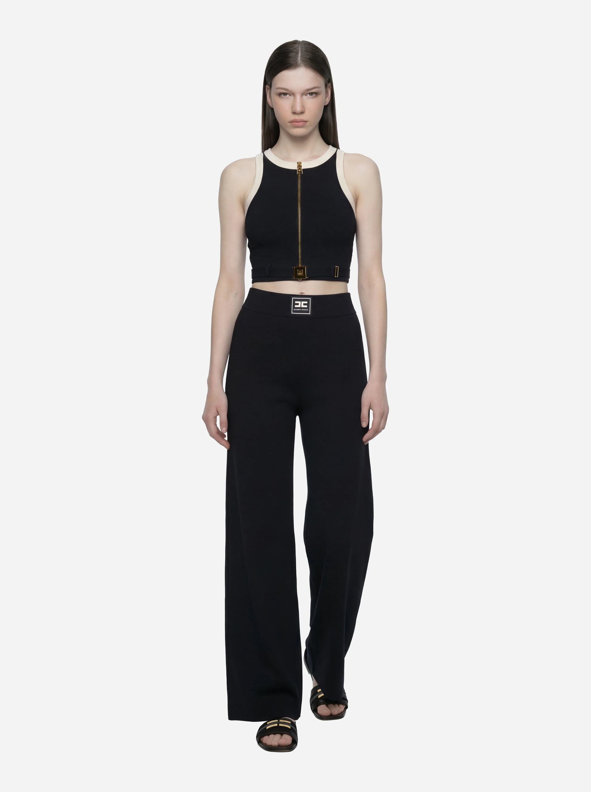 Top in maglia nero con bande in viscosa lucida con cintura