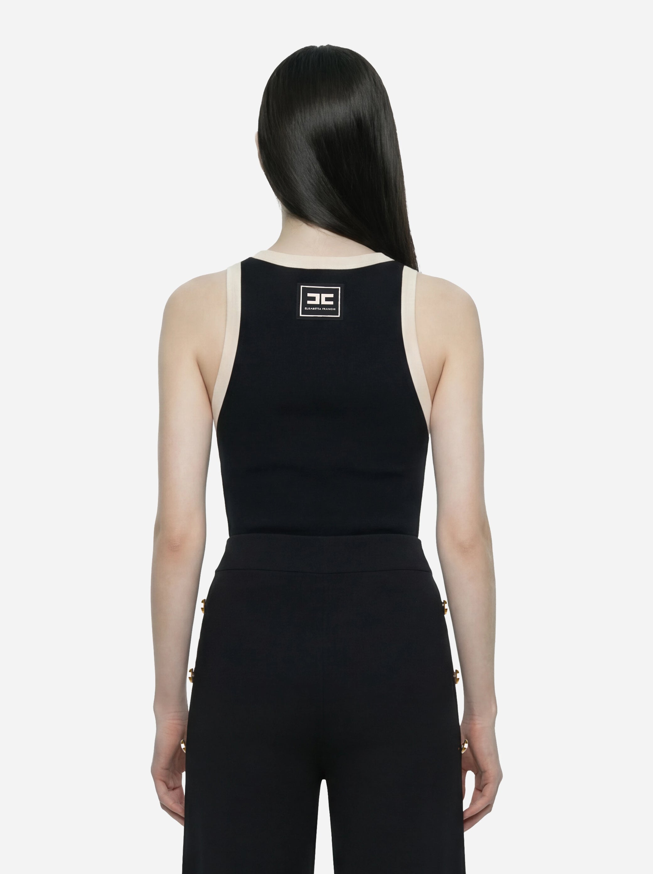 Top in maglia nero con bande in viscosa lucida con cintura