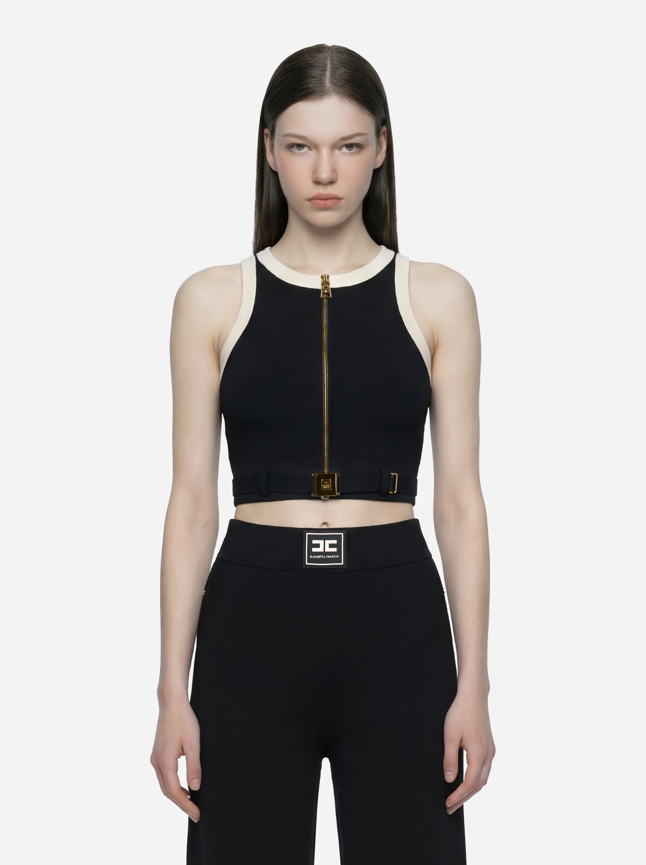 Top in maglia nero con bande in viscosa lucida con cintura