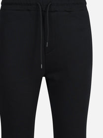 Pantaloni jogging in felpa neri - vista laterale e dettagli