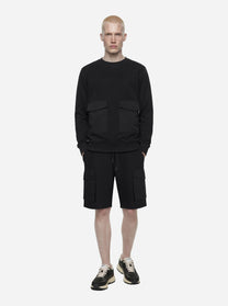 Shorts in jersey nero con tasche